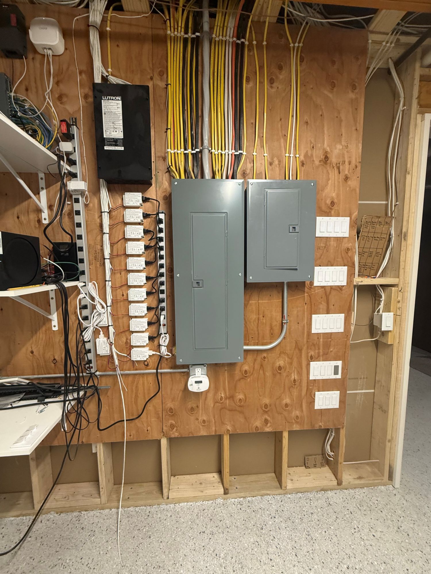 Clean residential service panel with Lutron lighting controls installed by MG Electric Inc.